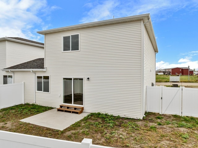 rear view of property with a patio area