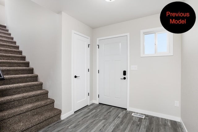 foyer entrance with hardwood / wood-style flooring