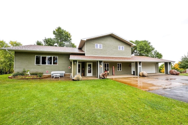 exterior space featuring a front yard, a garage, and covered porch