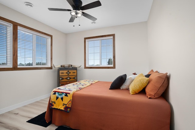 bedroom featuring ceiling fan and light hardwood / wood-style flooring