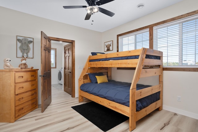 bedroom with ceiling fan, light wood-type flooring, and washer / dryer