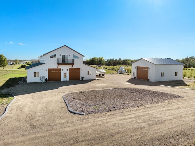 exterior space with an outbuilding and a garage