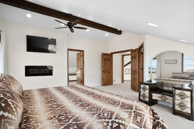 carpeted bedroom with ceiling fan and lofted ceiling with beams