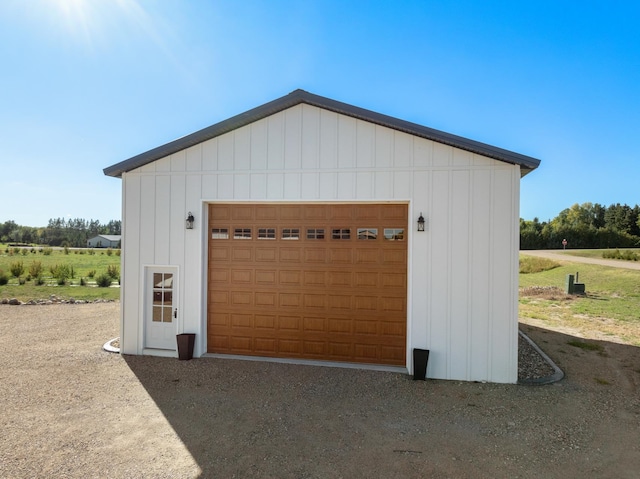 garage featuring wood walls