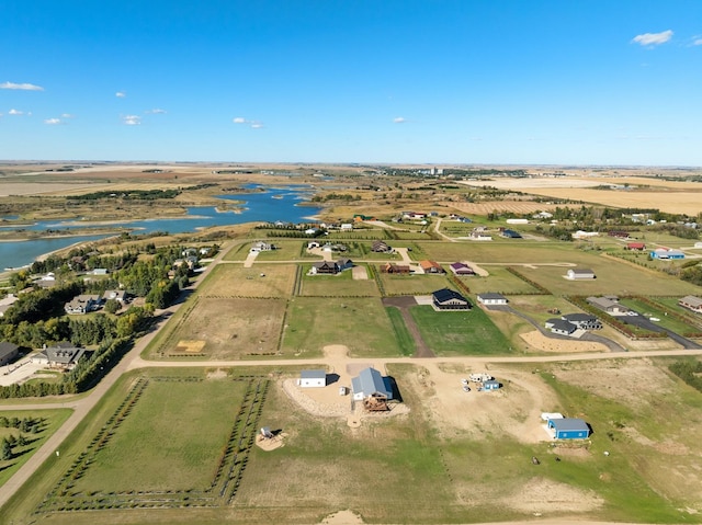 birds eye view of property featuring a rural view and a water view