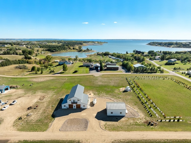 birds eye view of property with a rural view and a water view