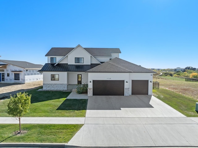 modern farmhouse with a garage and a front yard