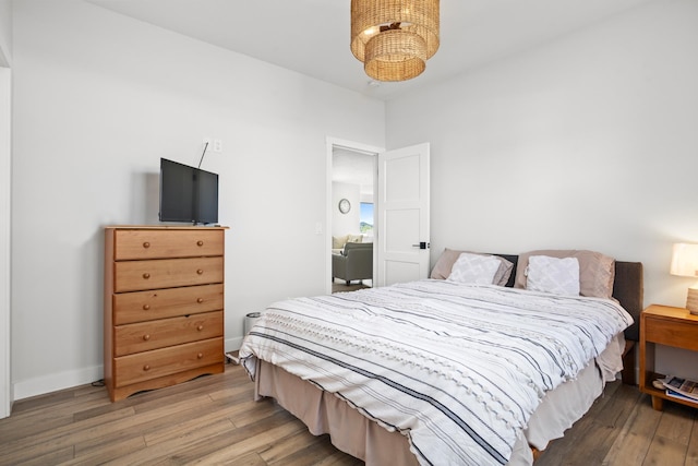 bedroom with wood-type flooring