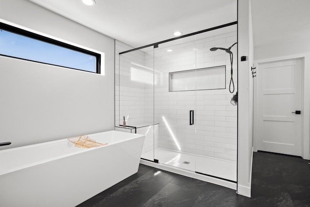 bathroom with separate shower and tub