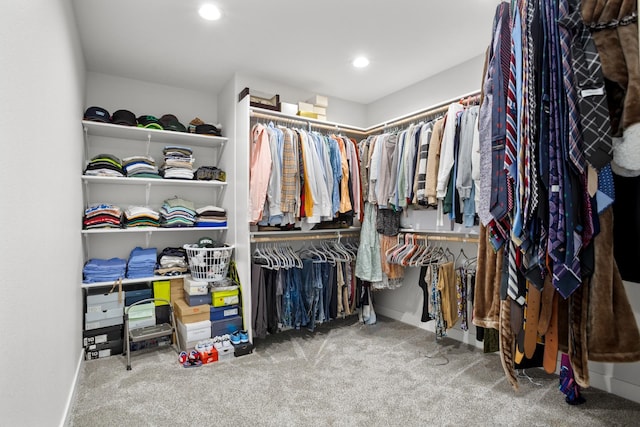 spacious closet with carpet floors