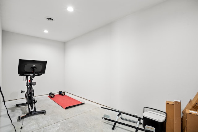 workout room featuring concrete floors