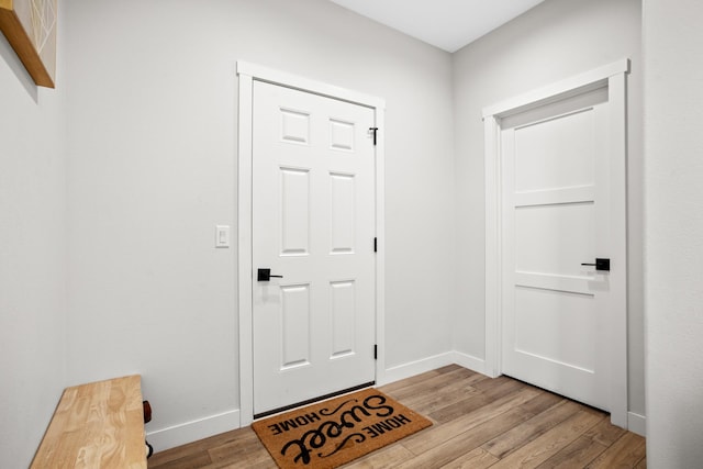 entryway with light hardwood / wood-style flooring