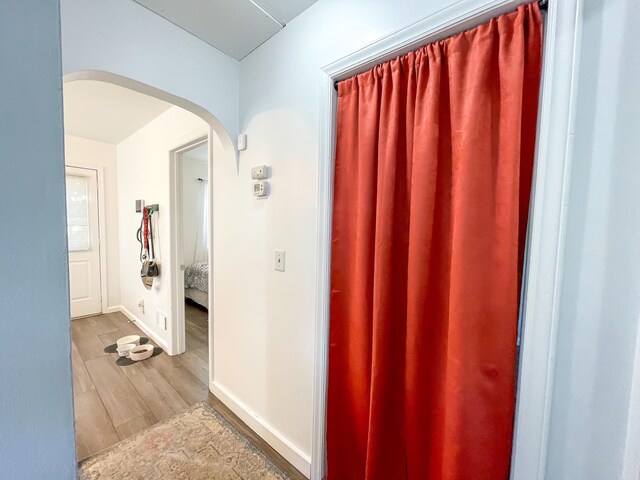 bathroom featuring baseboards and wood finished floors