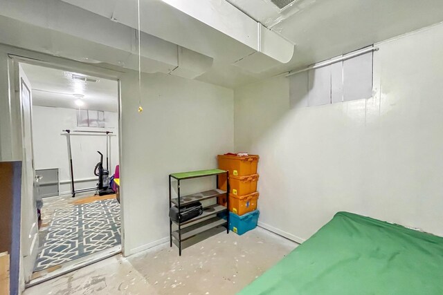 basement with visible vents and baseboards