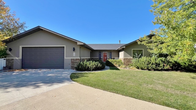 ranch-style house featuring a garage and a front lawn