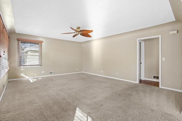 carpeted empty room with ceiling fan