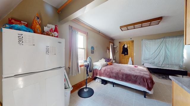 bedroom featuring white fridge