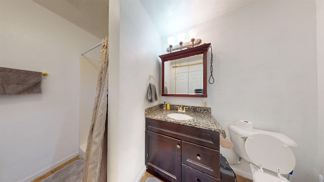 full bathroom featuring lofted ceiling, vanity, shower / bath combo with shower curtain, and toilet