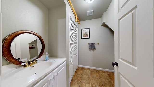 bathroom with vanity and tile patterned floors