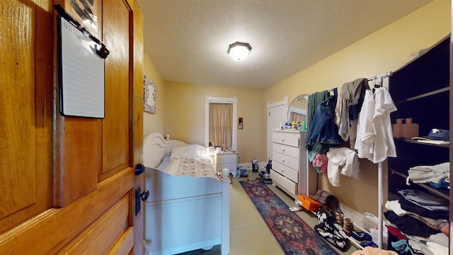 mudroom featuring a textured ceiling