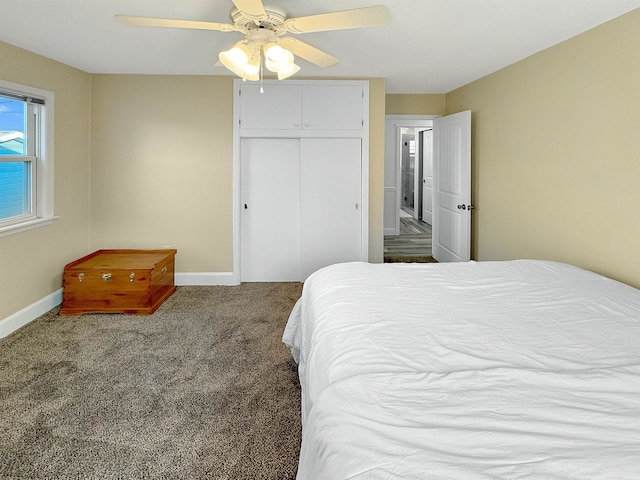 bedroom featuring carpet floors, a closet, and ceiling fan