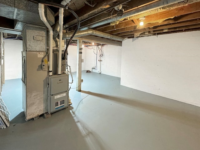 basement featuring heating unit