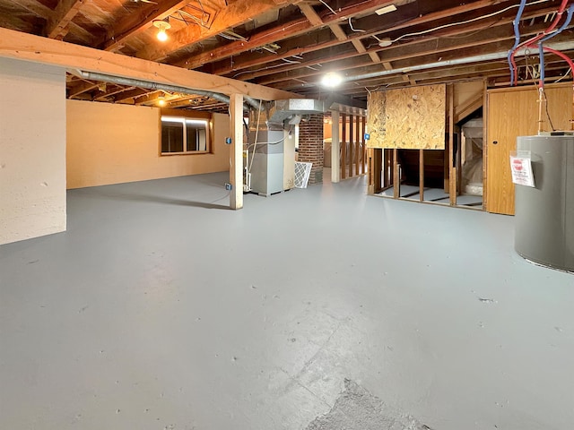 basement with water heater and heating unit