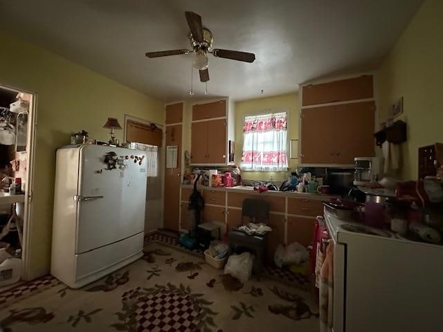 kitchen featuring white fridge and ceiling fan