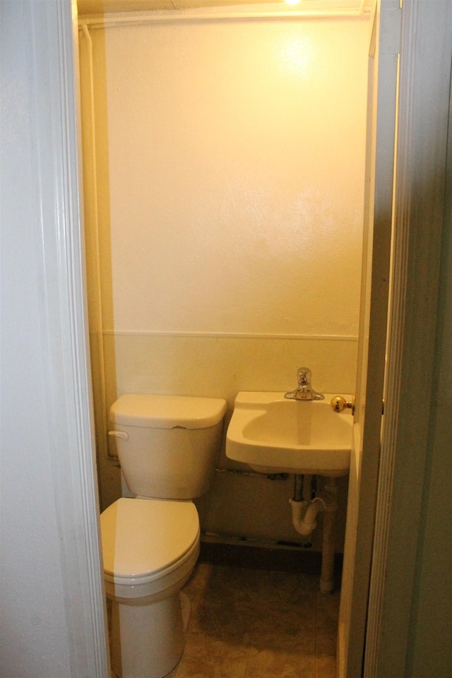 1012 4th St, Minot, ND 58701 - bathroom featuring a sink and toilet