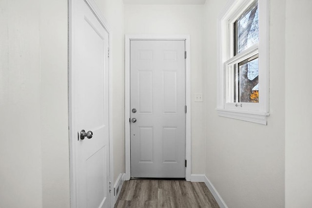 1012 4th St, Minot, ND 58701 - entryway featuring wood finished floors and baseboards