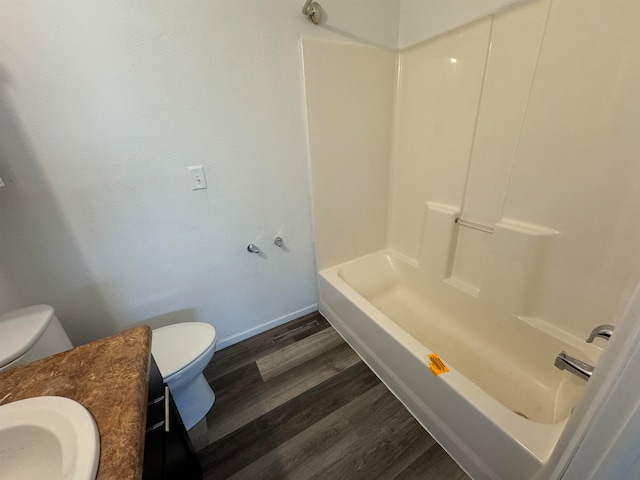 full bathroom with toilet, shower / tub combination, hardwood / wood-style flooring, and vanity