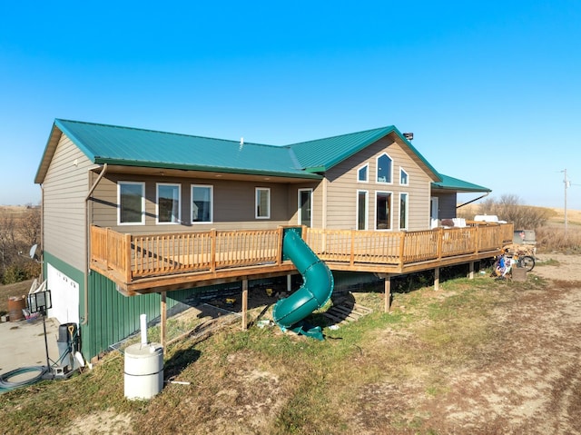 rear view of house with a wooden deck