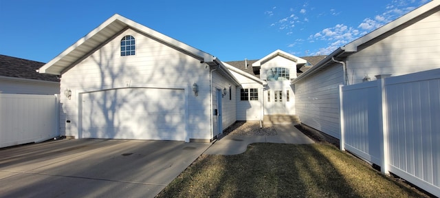 view of side of home featuring a garage