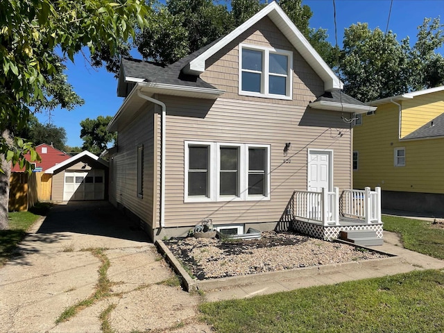 rear view of house featuring a garage