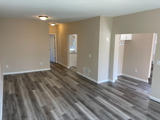 empty room featuring dark hardwood / wood-style floors