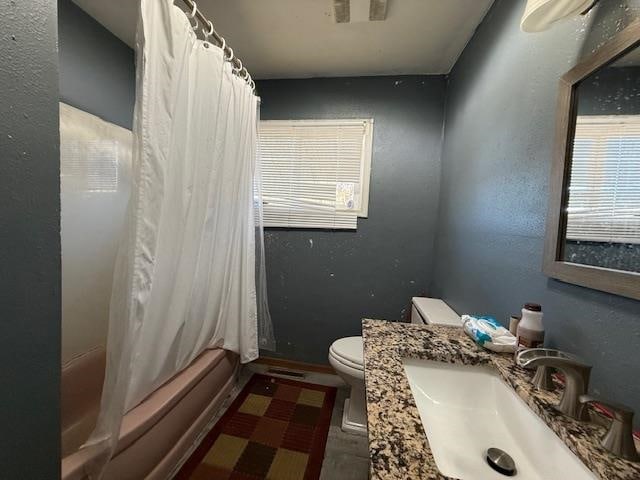 full bathroom featuring vanity, toilet, and shower / tub combo