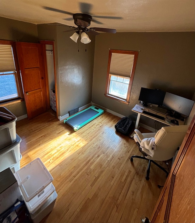 interior space featuring light wood-type flooring and ceiling fan