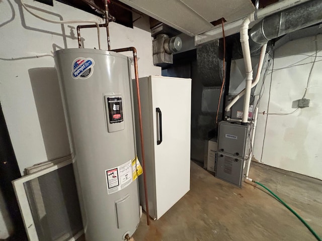 utility room featuring water heater