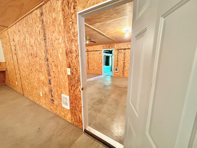 corridor with concrete flooring