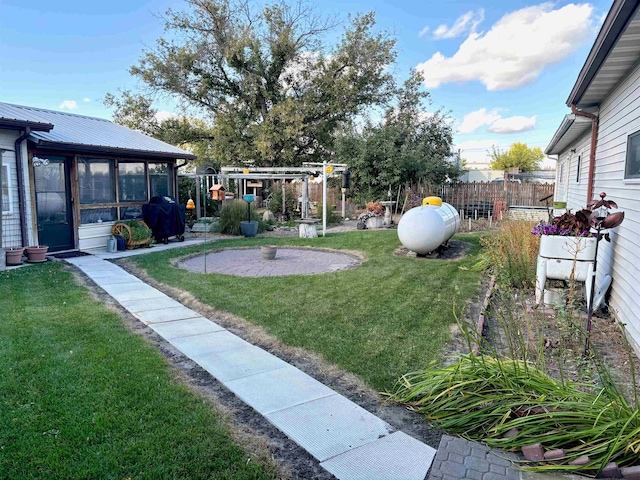 view of yard featuring a sunroom