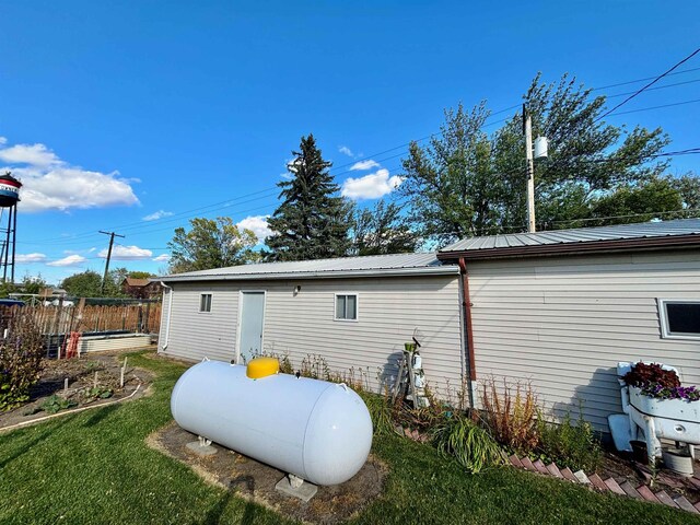 6 4th Ave, Towner, ND 58788 - rear view of property featuring metal roof