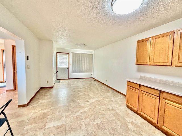 kitchen featuring a textured ceiling