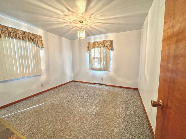 6 4th Ave, Towner, ND 58788 - carpeted spare room with baseboards