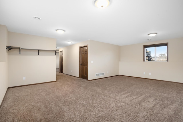 unfurnished room featuring carpet