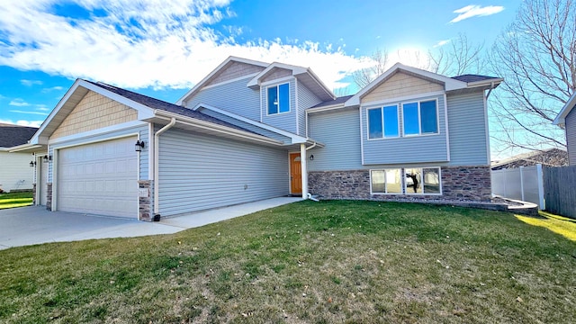 view of front of home featuring a garage and a front lawn