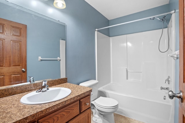 full bathroom featuring washtub / shower combination, tile patterned floors, vanity, and toilet