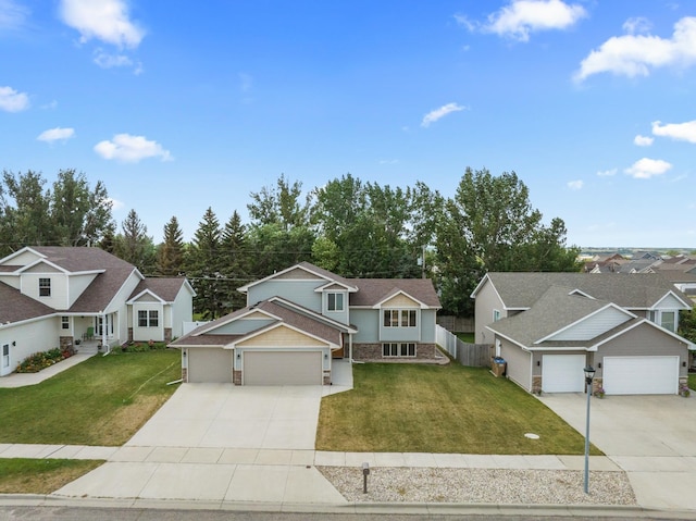 view of front of property featuring a front yard and a garage