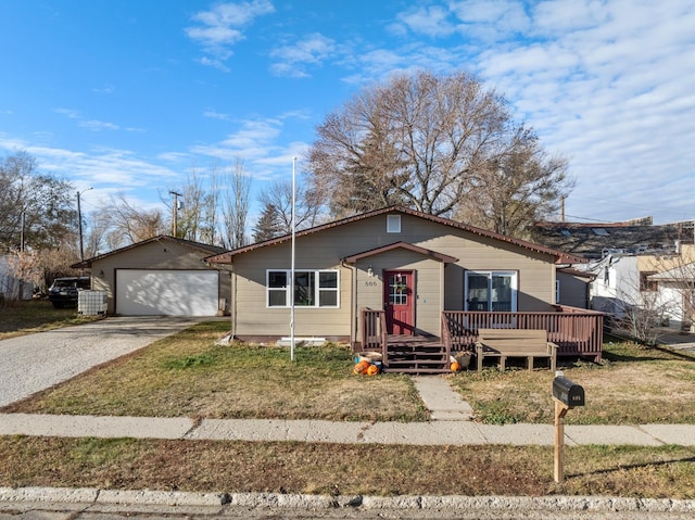 view of front of home with an outdoor structure, a garage, and a deck