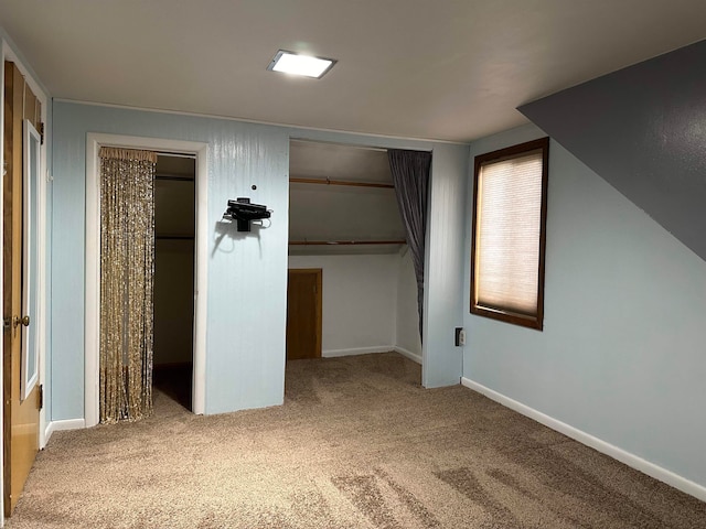 unfurnished bedroom with carpet floors and a closet