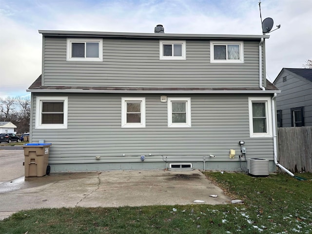 rear view of property featuring a patio area and central air condition unit